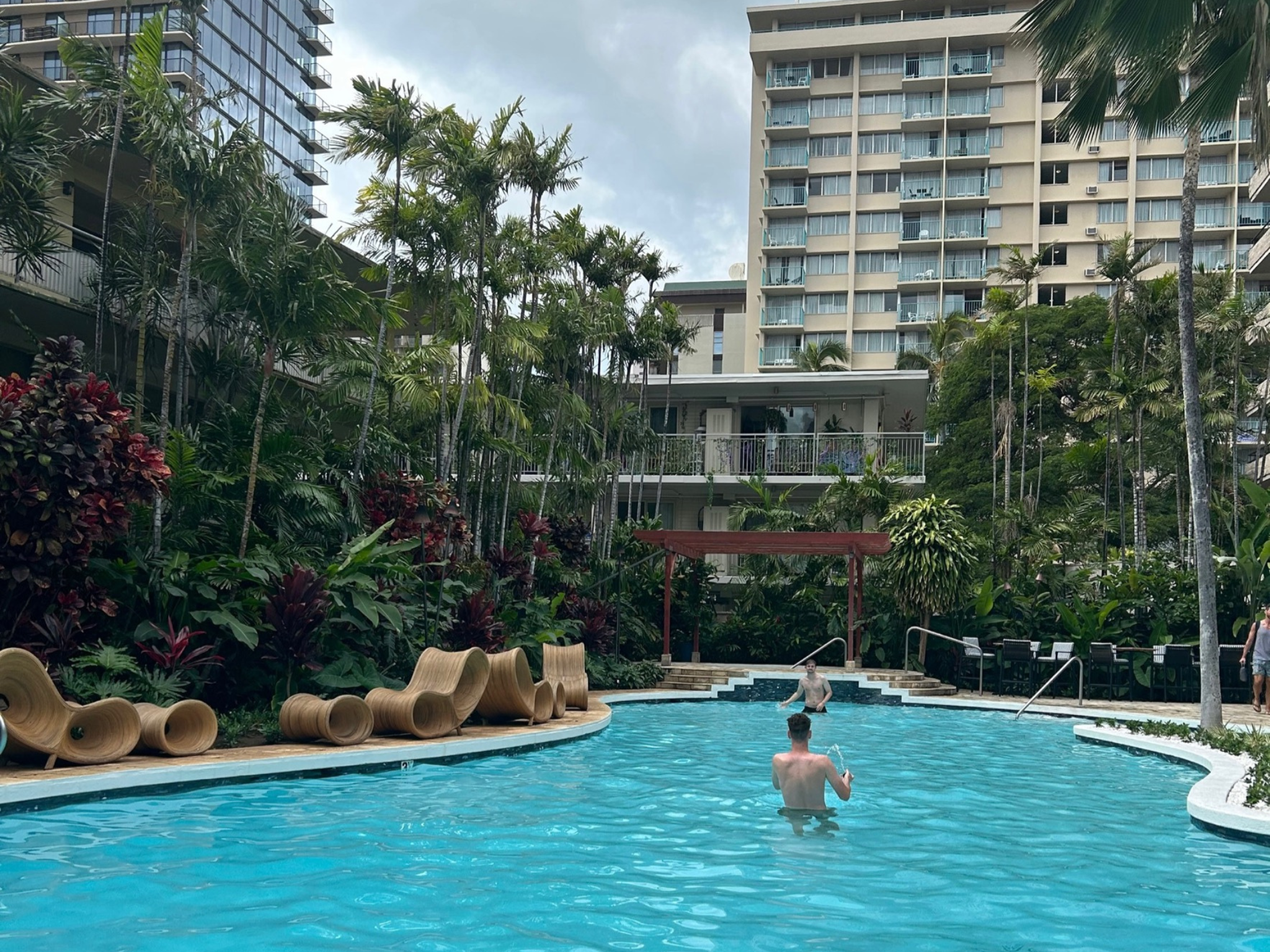 Hotel pool surrounded by trees