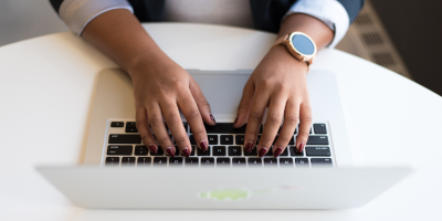 Person typing on laptop