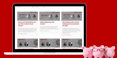 Laptop on red background displaying the video library webpage.